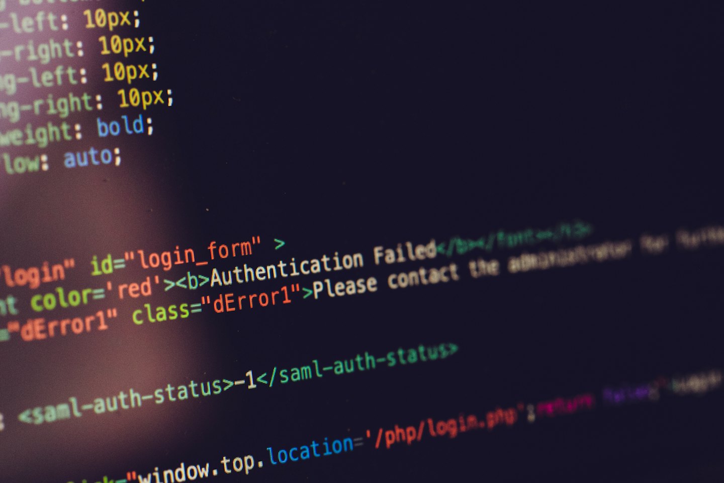 Computer screen shows programming code with an authentication error.